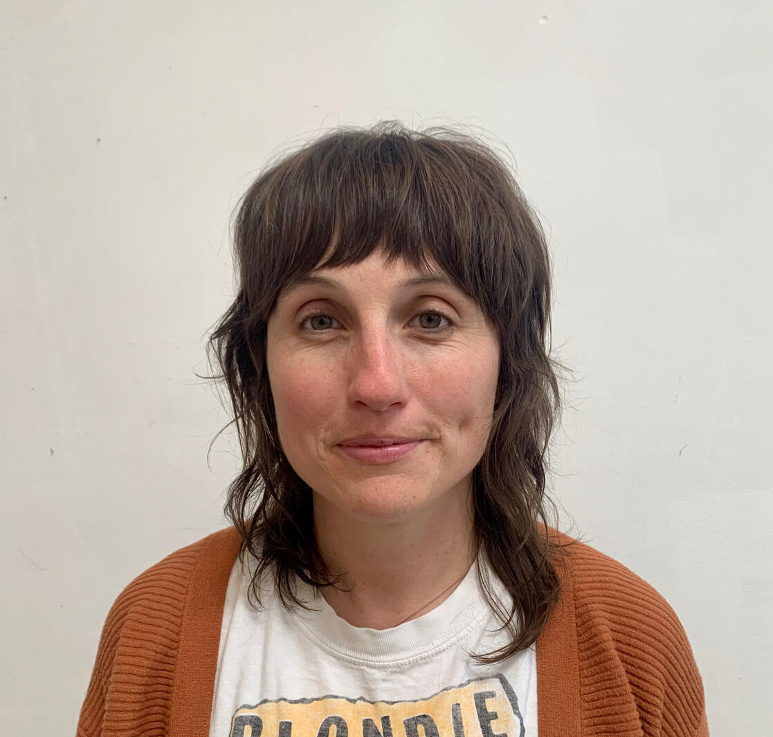 Asymmetrical, razored mid- length haircut with textured bangs